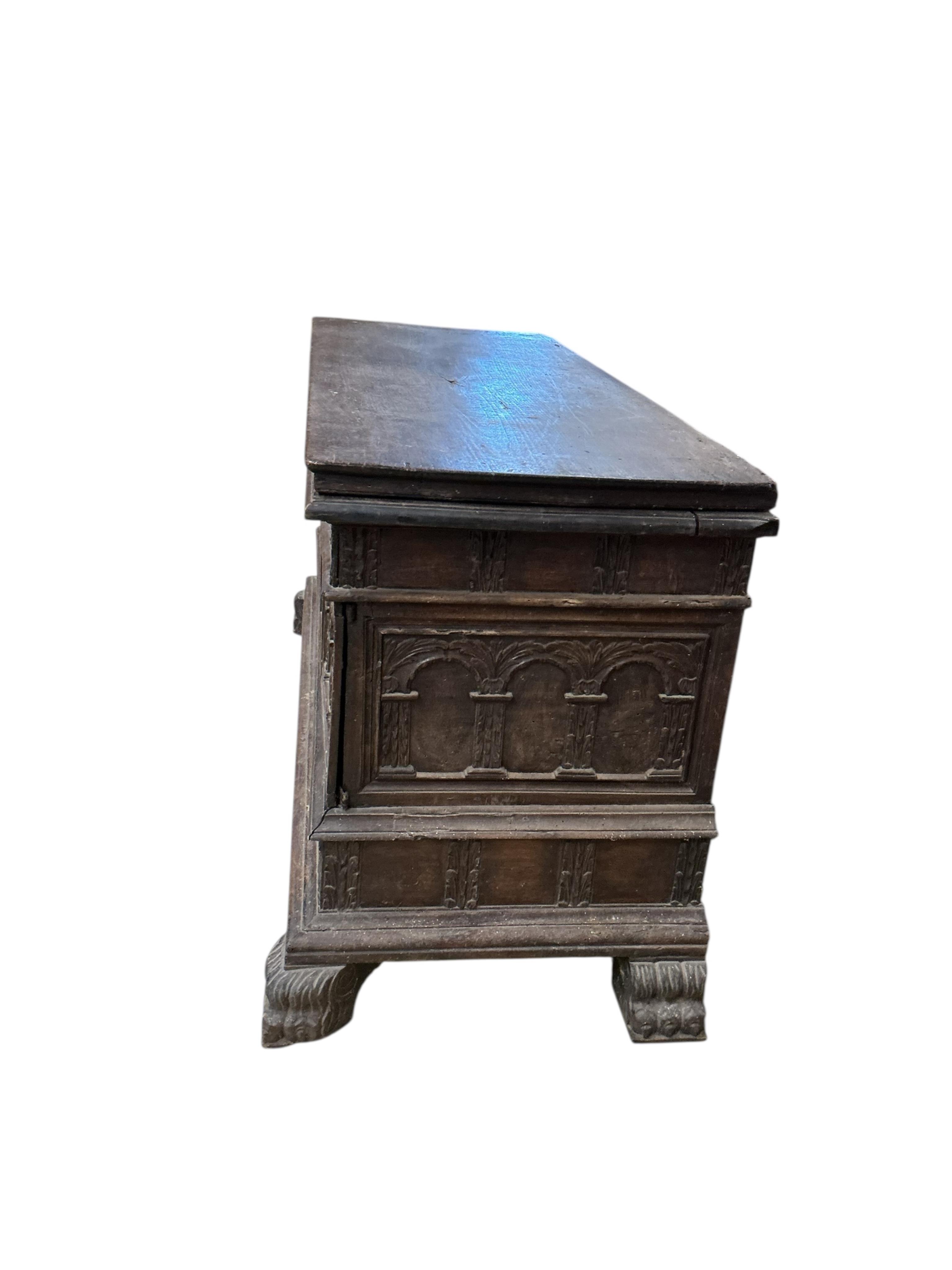 An Italian carved walnut cassone, width 138cm, depth 54cm, height 76cm